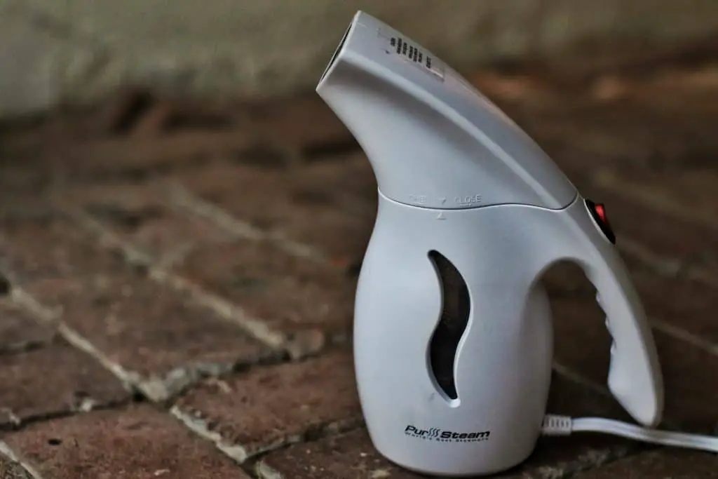 A close up of the PurSteam handheld steamer